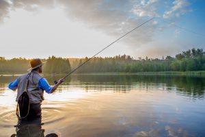 Young,Man,Flyfishing,At,Sunrise